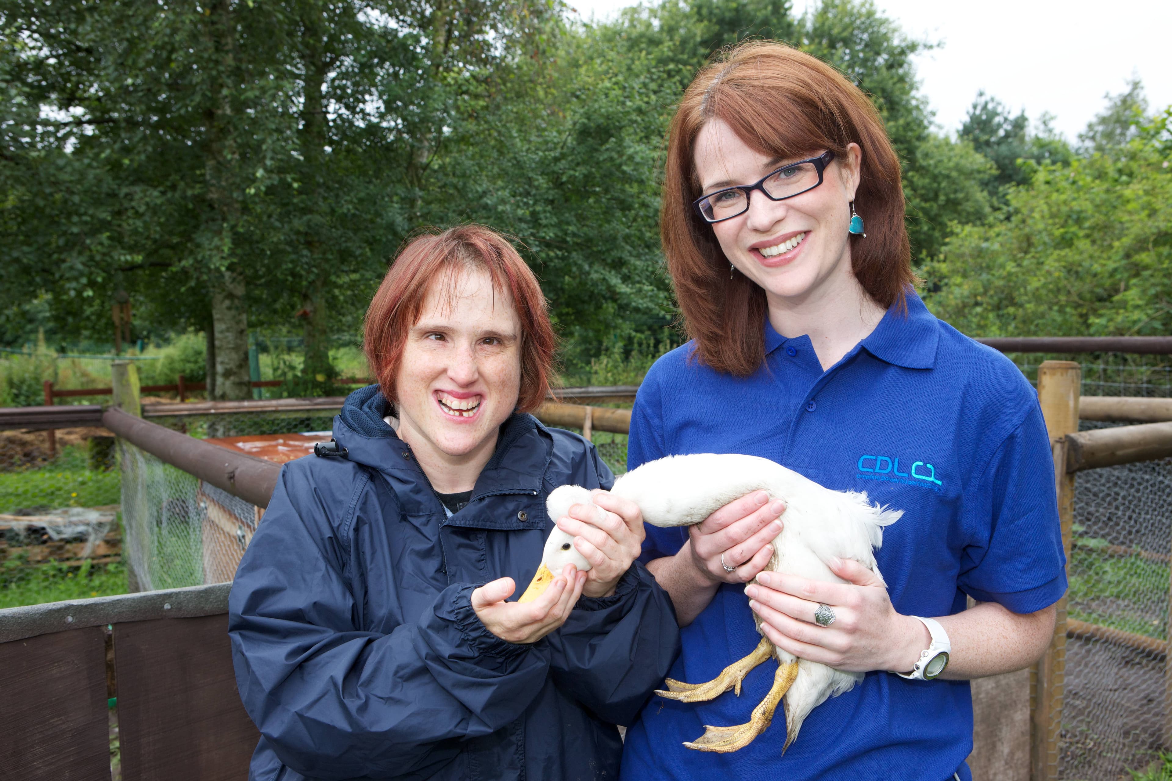 A CDL Fund volunteer meets a participant during a Farm Hands community day